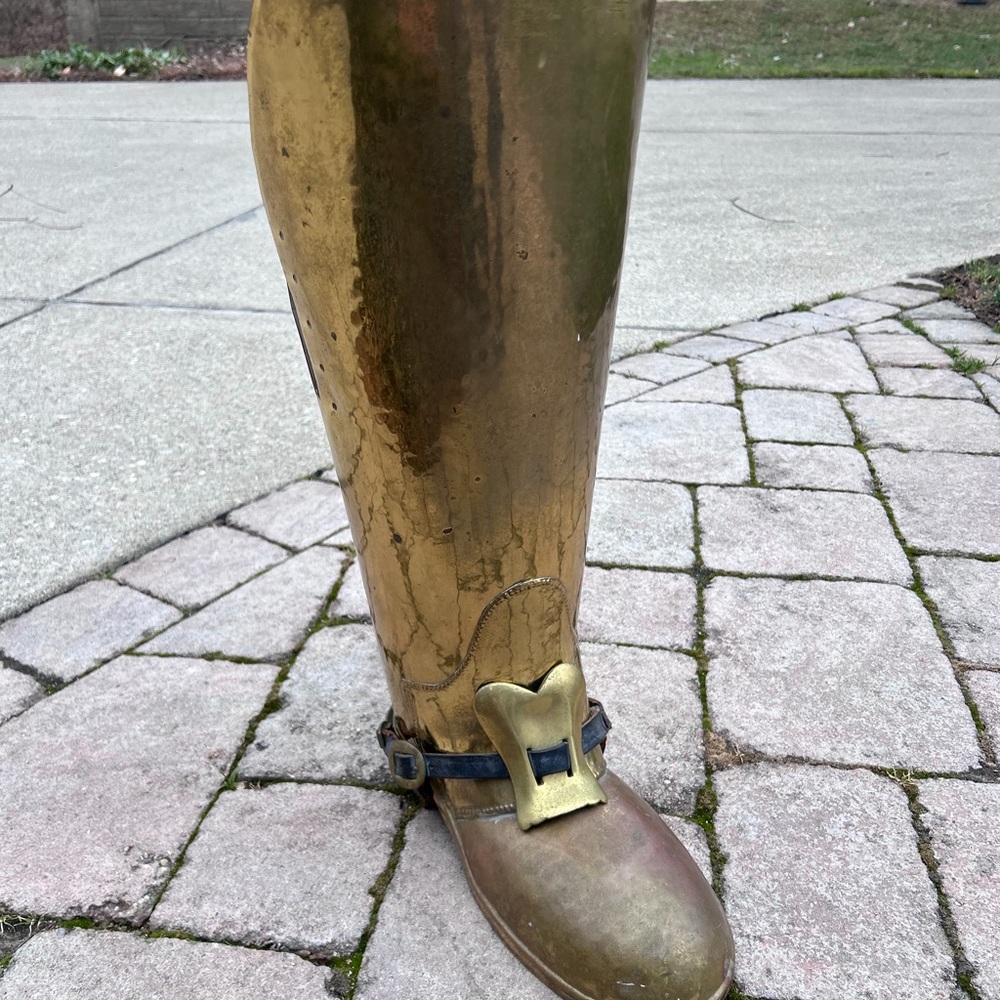 Vintage brass boot umbrella holder.